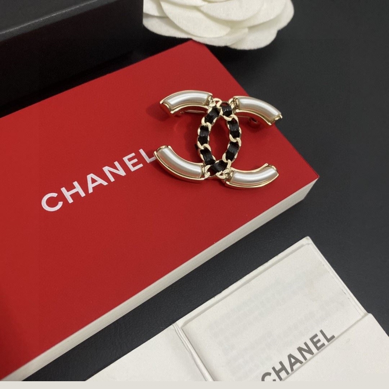 Ch*el brooches